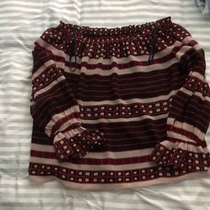 Three quarter sleeved off the shoulder shirt.